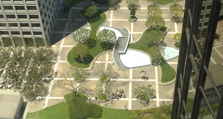 Aerial image of landscape with pavement, grass, and trees