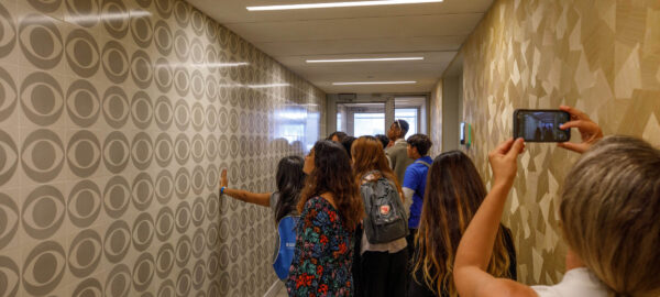 Heritage Project Students touching the CBS tiles