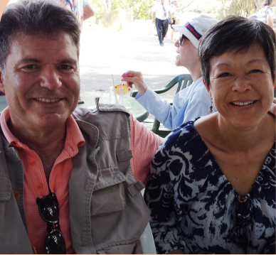 headshot of man and woman smiling