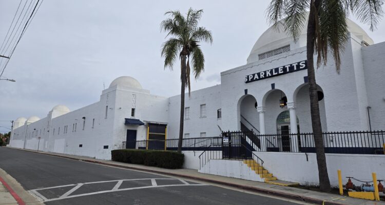 An oblique view of the Sparkletts Bottling Plant, showing the classical entry and industrial portions of the building