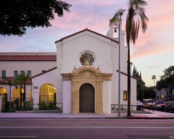 Primary facade of two story spanish colonial revival church