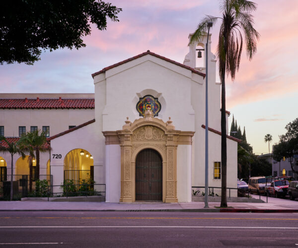 Primary facade of two story spanish colonial revival church
