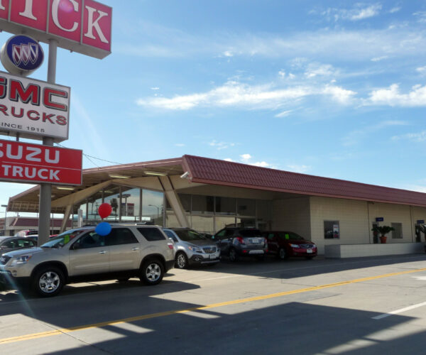 Side view of the Reynolds Buick and its sign