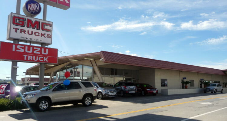 Side view of the Reynolds Buick and its sign