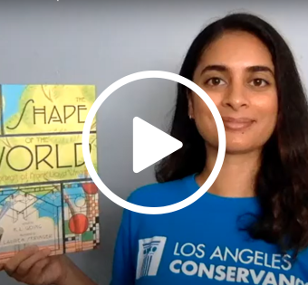 Young woman in blue t-shirt reading 