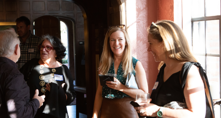 People enjoy a Cornerstone event in a historic residence.