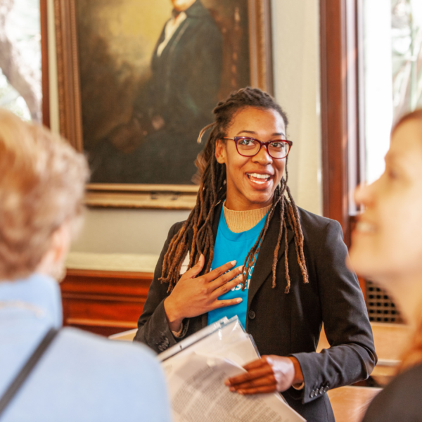 Tour guide shares history of the Ebell to tour goers.