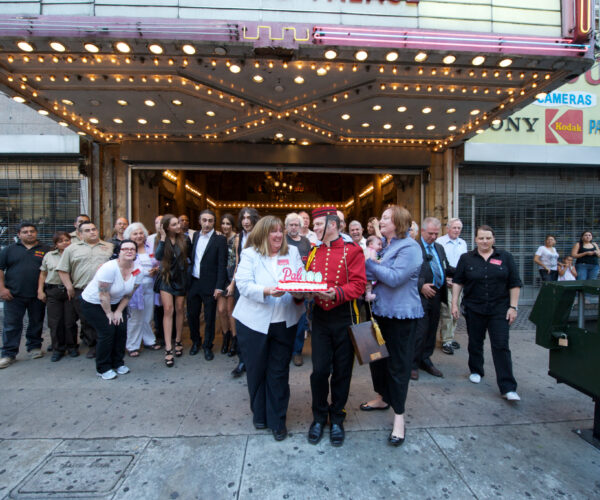 Linda Dishman (center) and Conservancy volunteers celebrate the Palace Theatre’s 100th birthday in 2011 as part of Last Remaining Seats. Photo by Gary Leonard.
