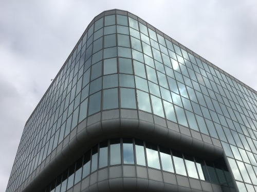 The FAA building features a rounded, taut glass-and-aluminum-skinned façade.