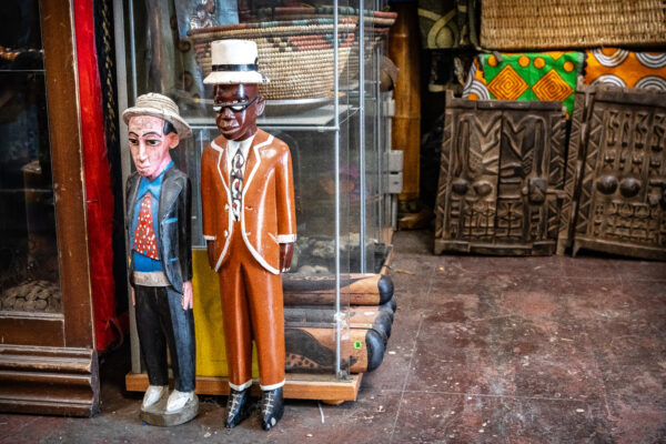 A white ceramic doll and a black ceramic doll.