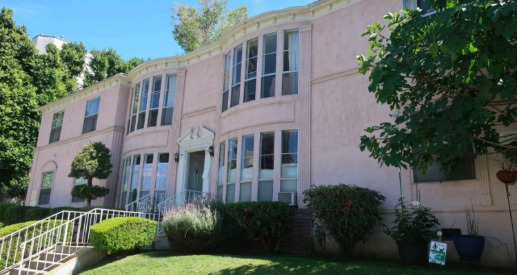 Two story exterior of American Colonial Revival apartment