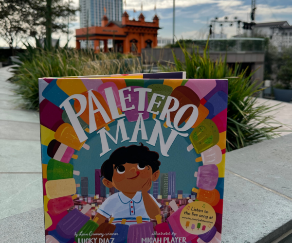 Paletero Man book in focus with Angels flight in the background.