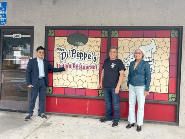 Exterior of Alex Di Peppe's Restaurant; the owner Larry with Anthony and Grace.