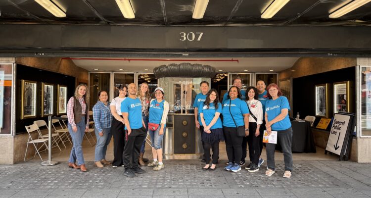 2025 Last Reaming Seats Committee Members celebrate outside the Million Dollar Theatre in August 2025