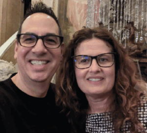 headshot of man and woman smiling