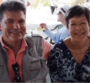 headshot of man and woman smiling