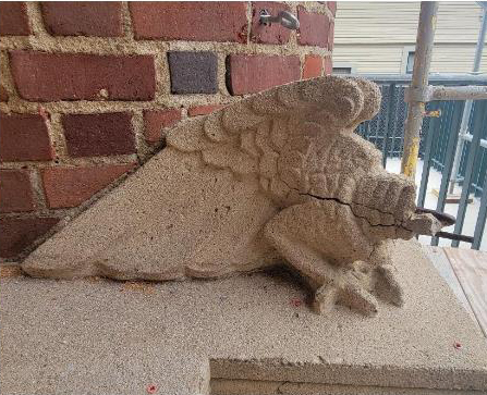 Dick Wolf Drama Center exterior grotesque damaged.