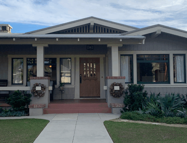Front view of a grey craftsman bungalow