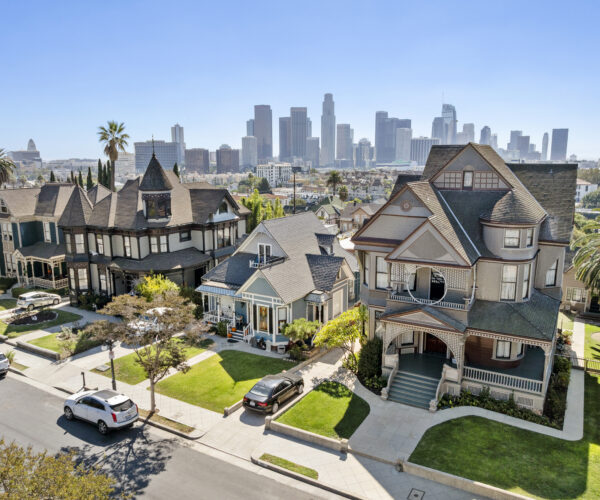 The south side of Carroll Avenue as seen from drone, with the DTLA skyline in the background.