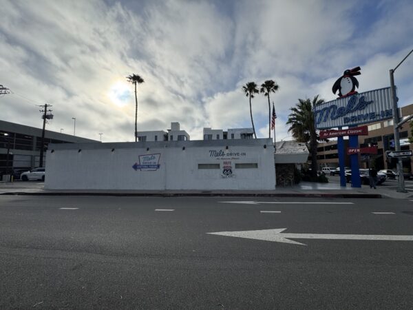A side view of Mel's Drive-In with sign visible