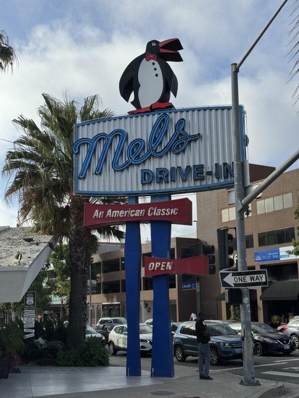 The Mel's Drive-In sign with the Penguin on top