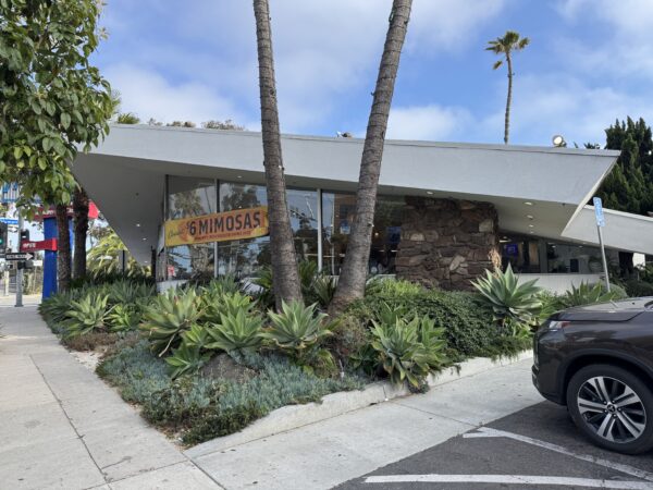 An angled view of Mel's, showing the cantilevered, dramatic roofline